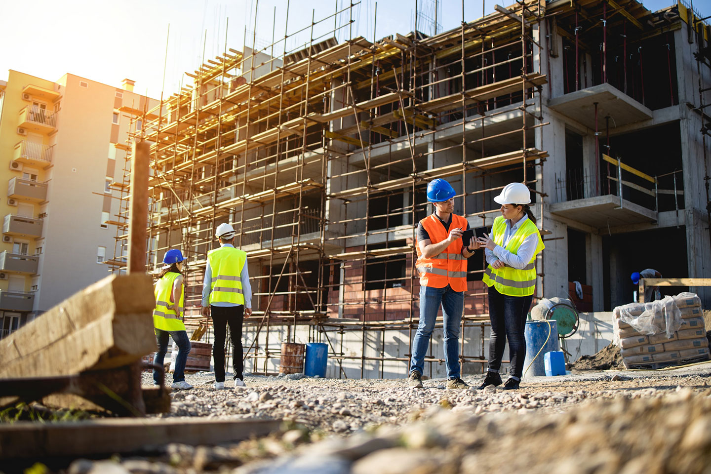 A safety consultant speaking with an operator at a worksite.