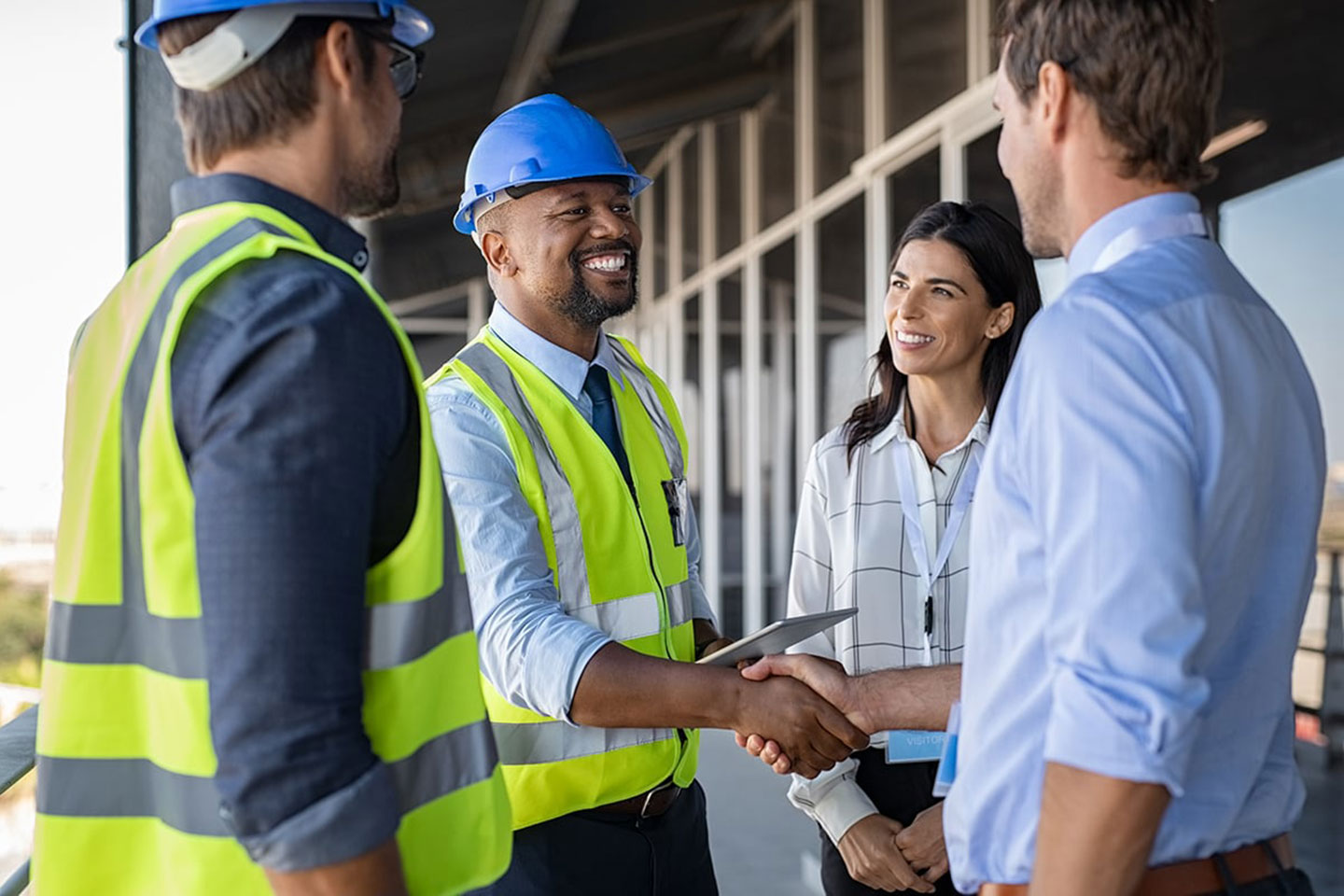 A safety consultant assisting a group of 3 people.